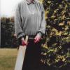 grandmother holds a homemade cricket bat