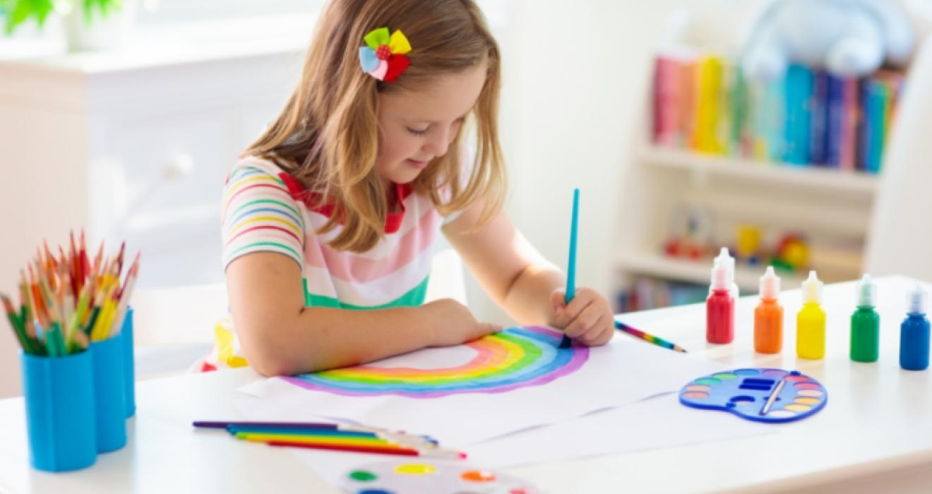 picture of a happy child doing craft