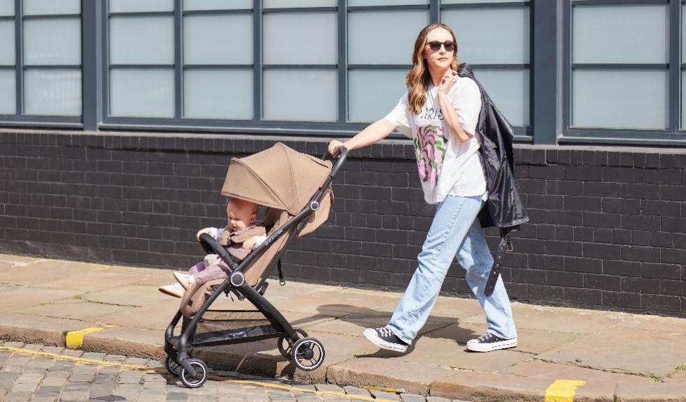 picture of mum using the Introducing Aries Auto-Fold Stroller
