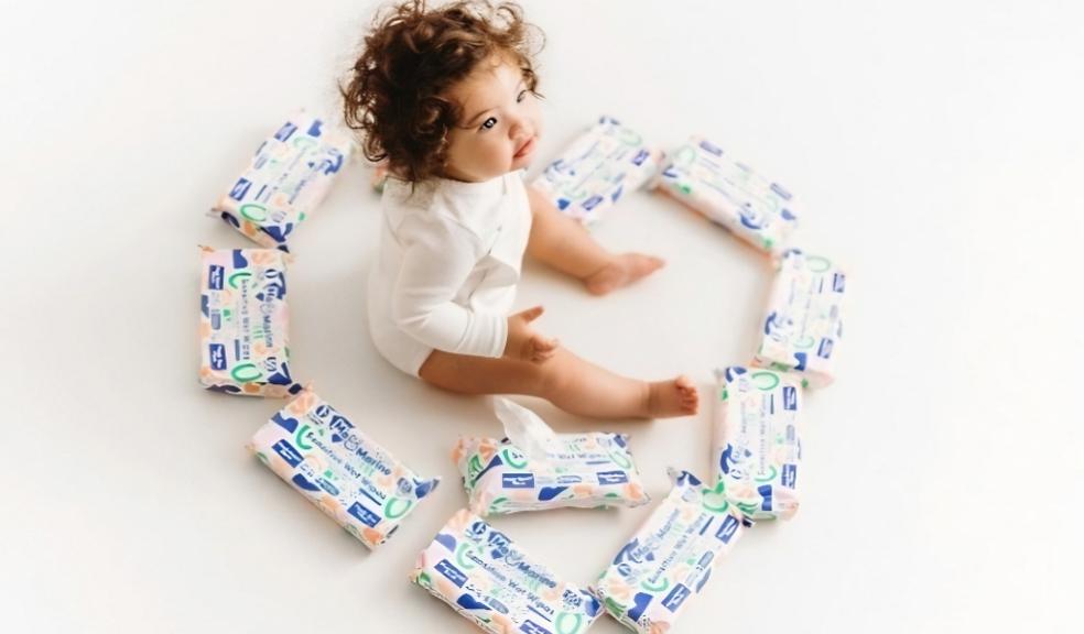 a baby sat on the floor surrounded by Mo and Marine baby wipes picture of a baby sat on the floor surrounded by Mo and Marine baby wipes
