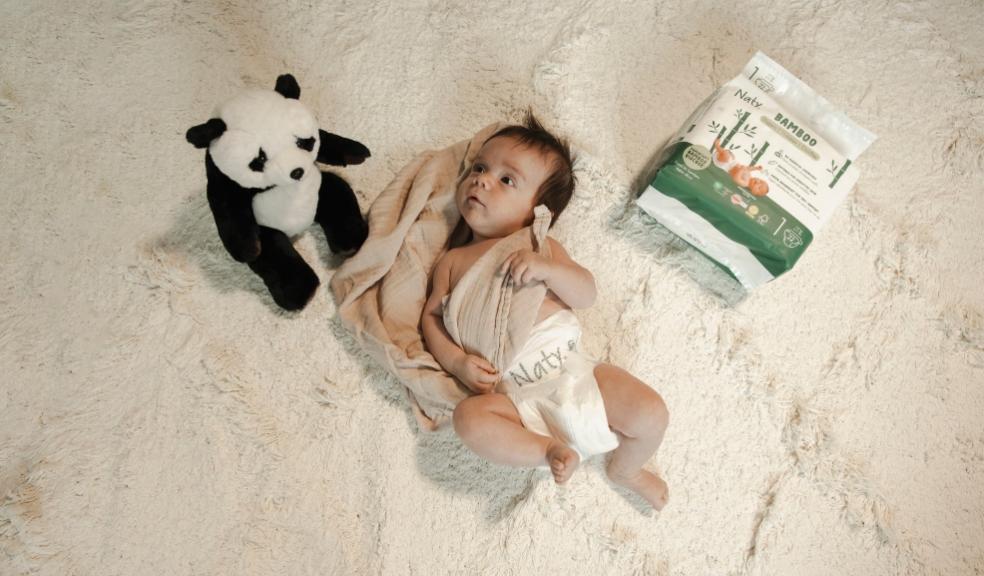 a newborn baby on a fluffy rug with Naty bamboo nappies for world bamboo day picture of a newborn baby on a fluffy rug with Naty bamboo nappies for world bamboo day