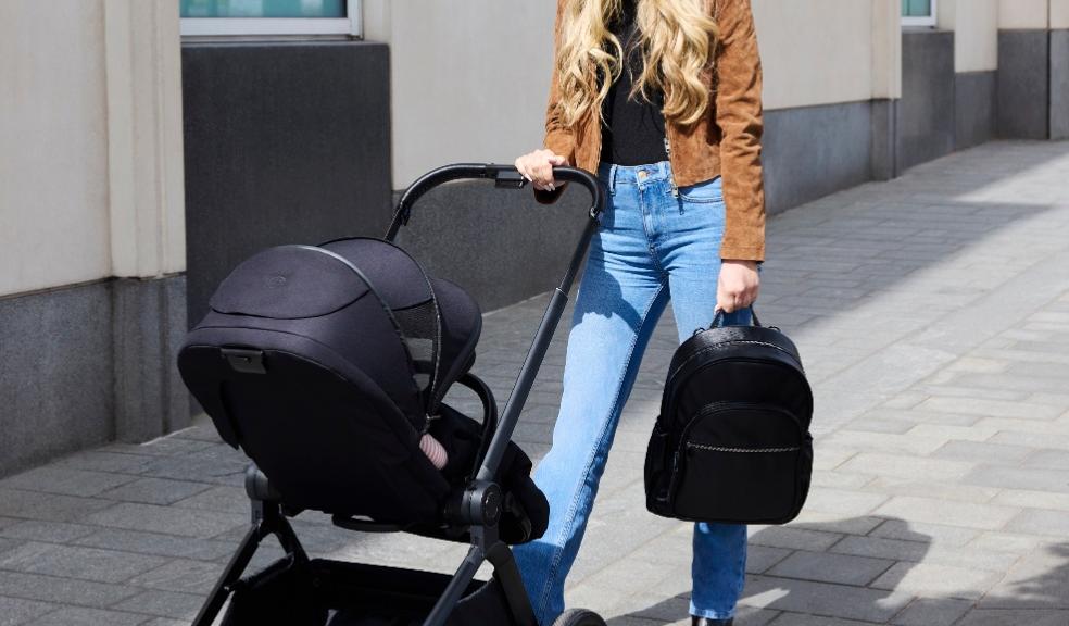 picture of a mum using the Altima Black 9 piece pushchair set