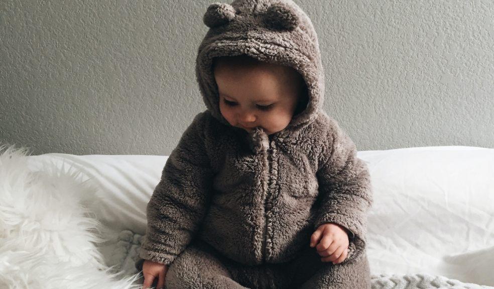 Baby in cute teddy outfit