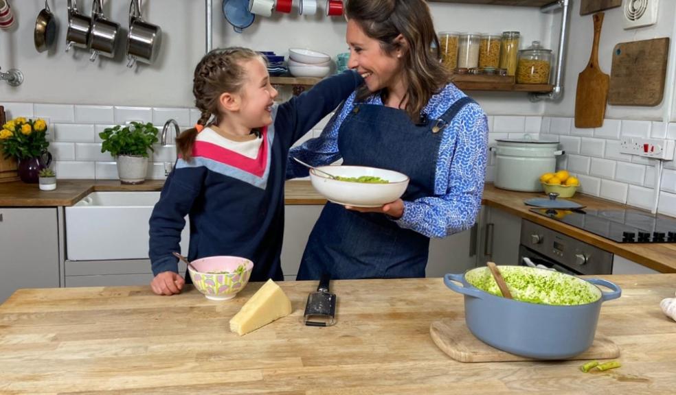 Picture of Dr Sarah Ockwell smith teaching a child how to cook