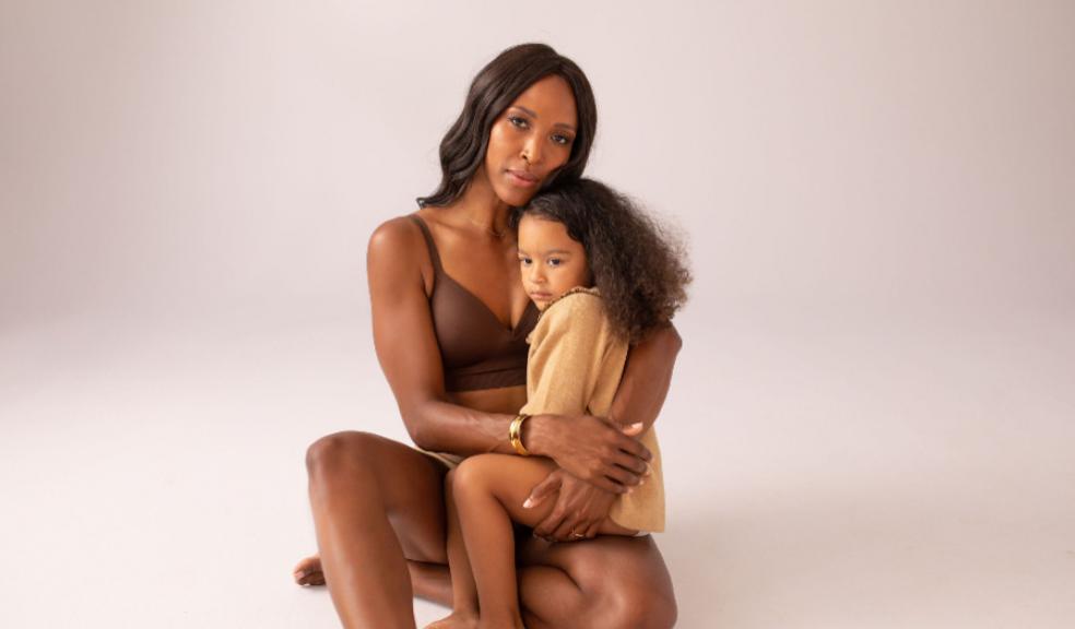 picture of woman wearing a post nursing bra with a child on her lap