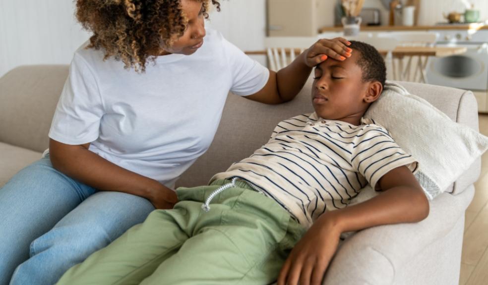 a mum looking after her unwell child picture of a mum looking after her unwell child