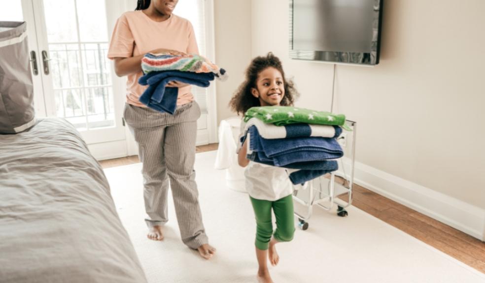 picture of a child helping her mum with some household chores in a fun way