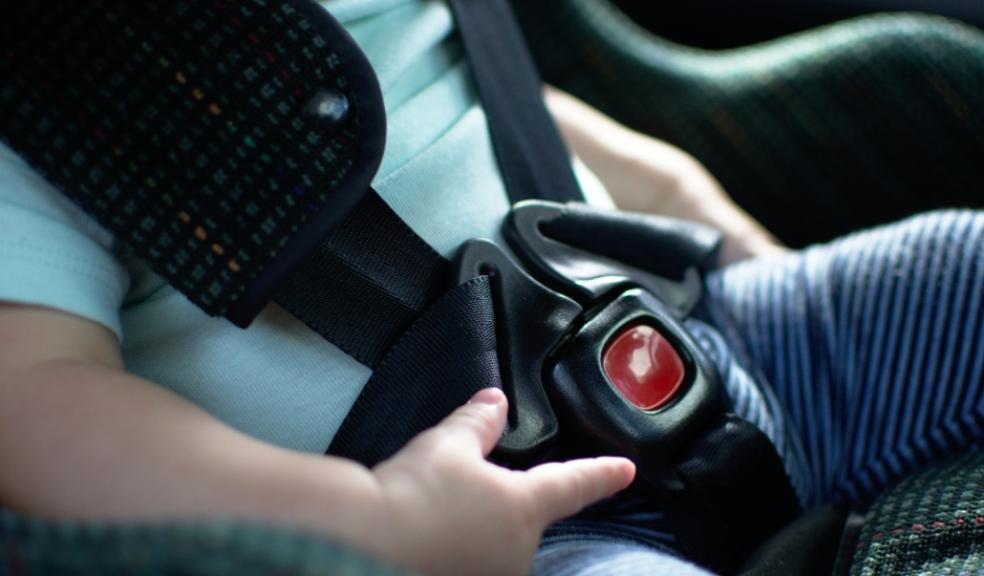 picture of a close up picture of a child in a rear facing car seat
