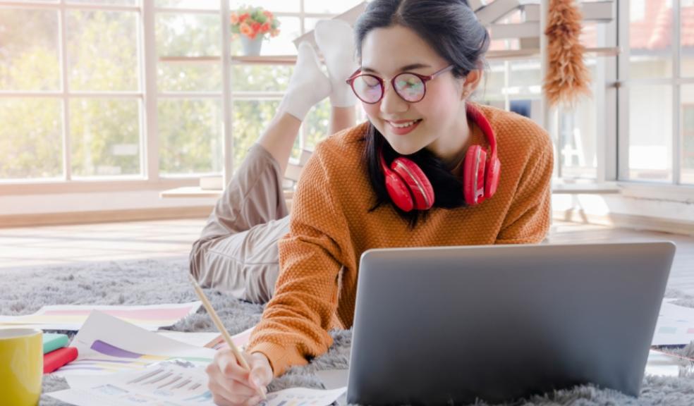 picture of a happy teen following exam revision tips to make a levels less stressful