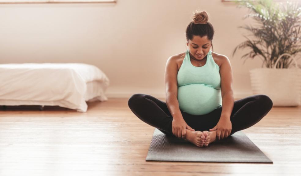 picture of a pregnant woman doing pilates
