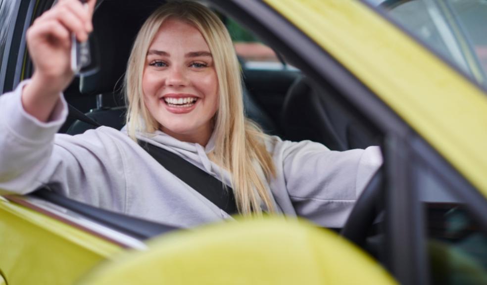 picture of a teenager with her first car