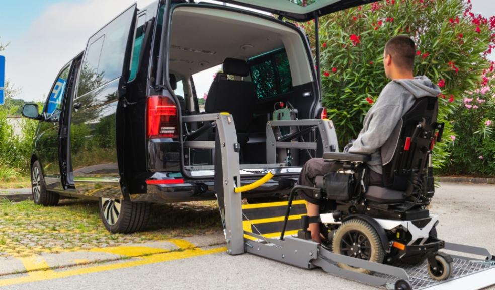 picture of a wheelchair user getting into a wheelchair accessible car