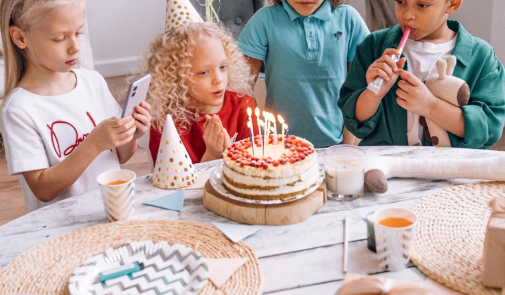 children at a birthday party with party hats and birthday cakes picture of children at a birthday party with party hats and birthday cakes
