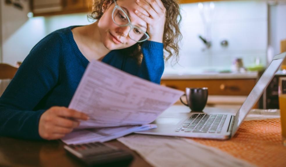picture of a mum trying to juggle the cost of rising childcare bills