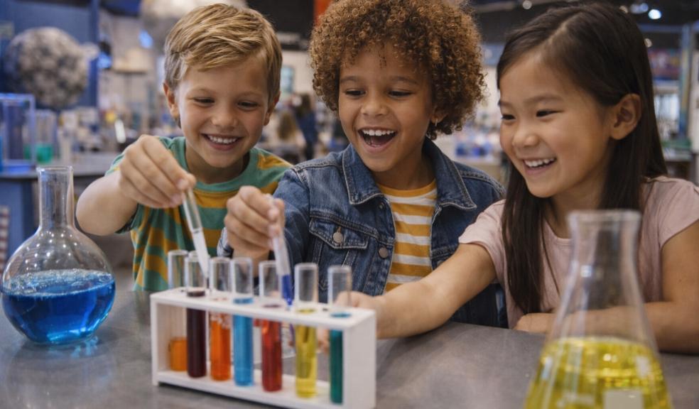 picture of children exploring science experiments at a museum