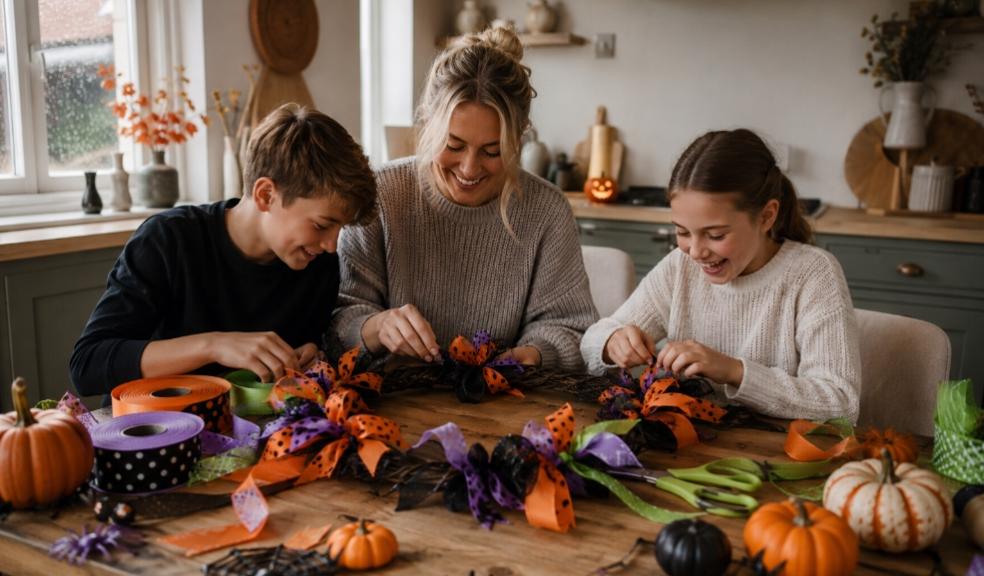 a happy family creating a halloween wreath using halloween ribbon picture of a happy family creating a halloween wreath using halloween ribbon