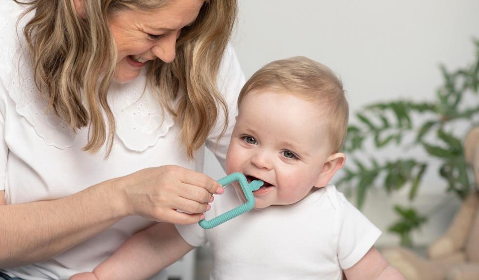 picture of a mum and baby with a cheeky chompers flexi brush