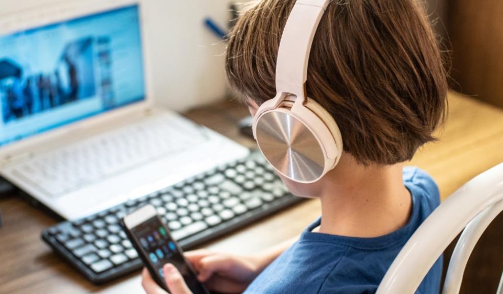 picture of a Child using technology to do homework