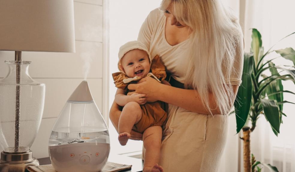 picture of mum and happy baby with crane humidifier