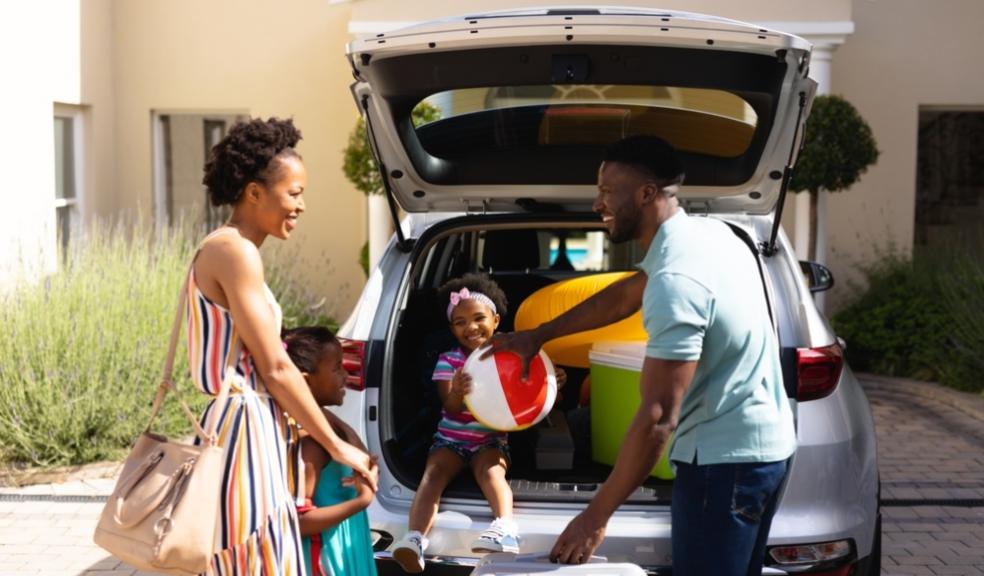 Family packing a car to go away picture of a Family packing a car to go away