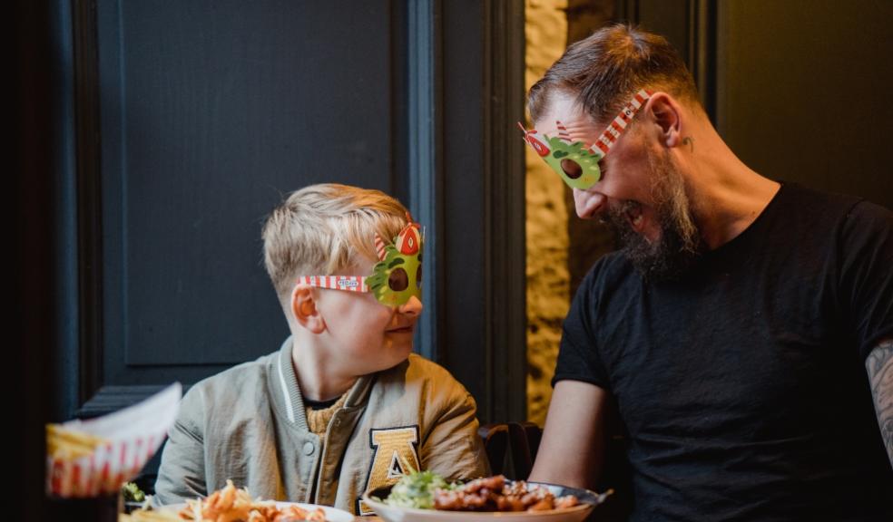 picture of a Father and son eating at TGI FRIDAY