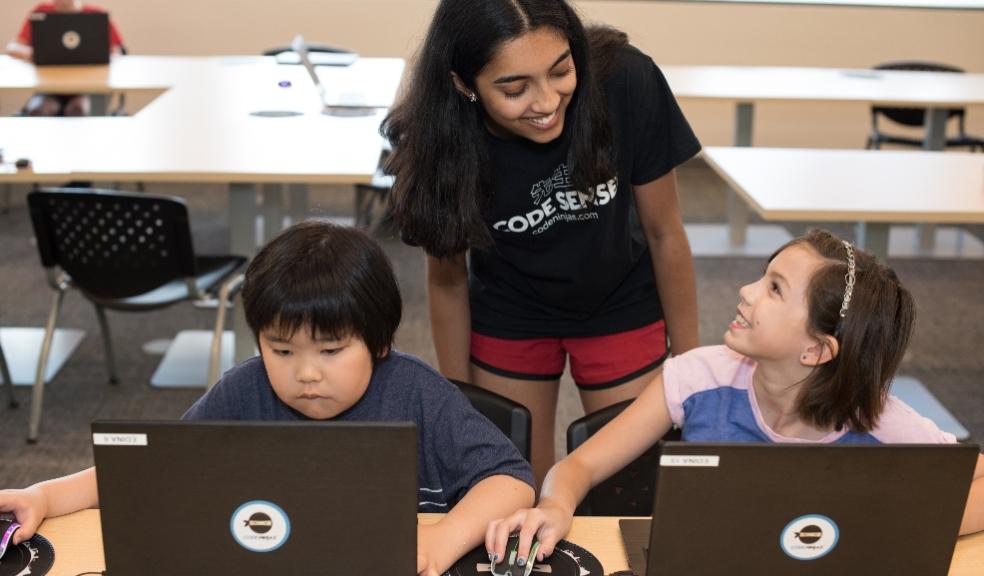 picture of Girl Boy and Sensei learning to code