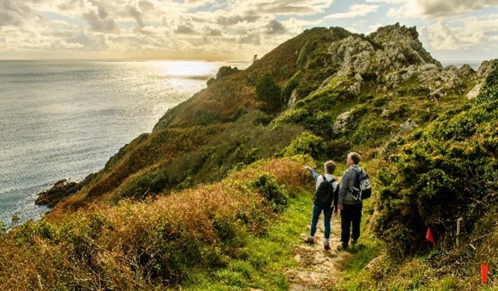 Picture of a family walking on a cliff path in Guernsey