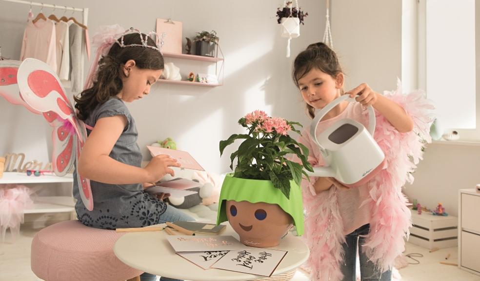 picture of children looking after houseplants