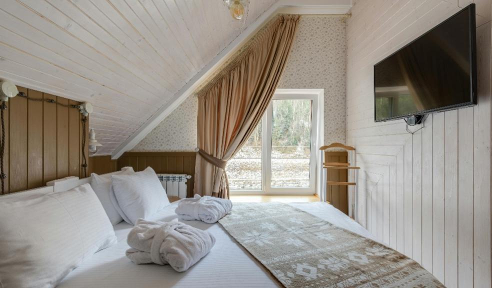 picture of a guest bedroom with a double bed and tv