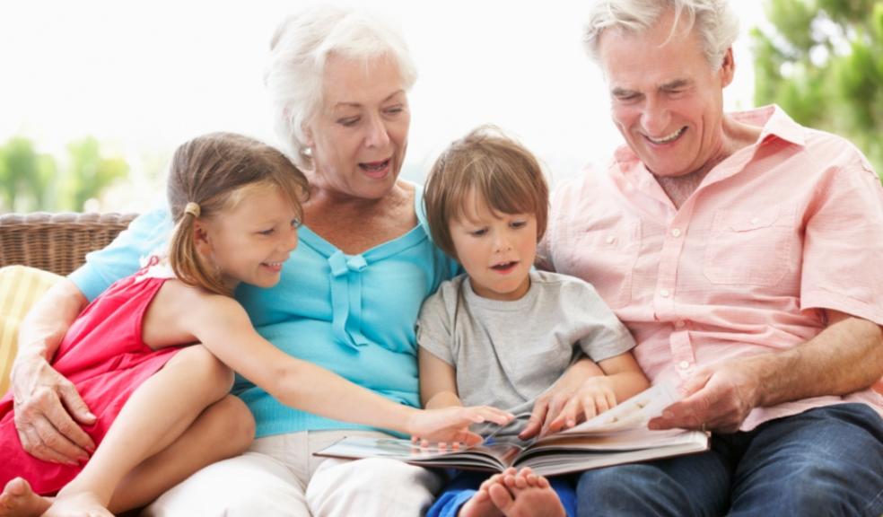 Picture of grandparents reading with their grandchildren