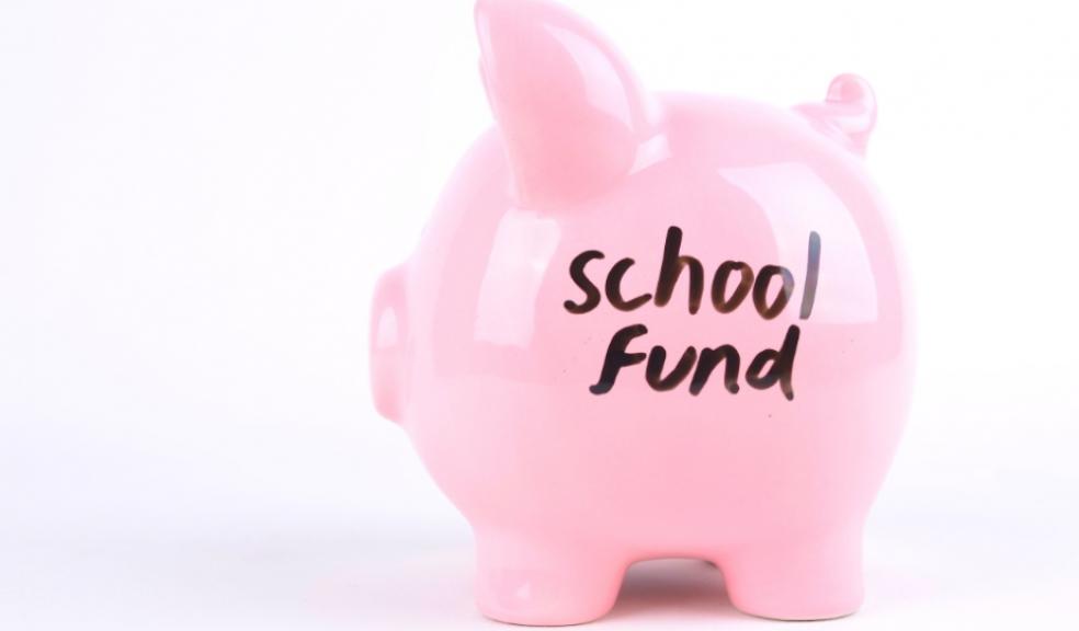 Picture of a piggy bank with school fund written on the side