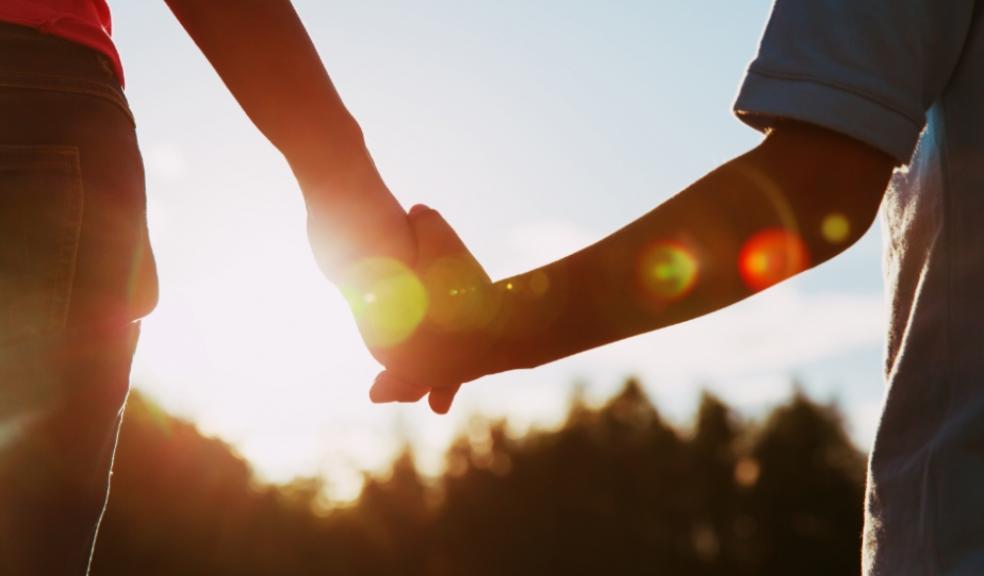 Picture of a child holding an adults hand