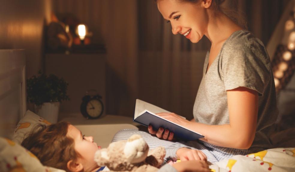 Picture of a mum reading her child a bedtime story
