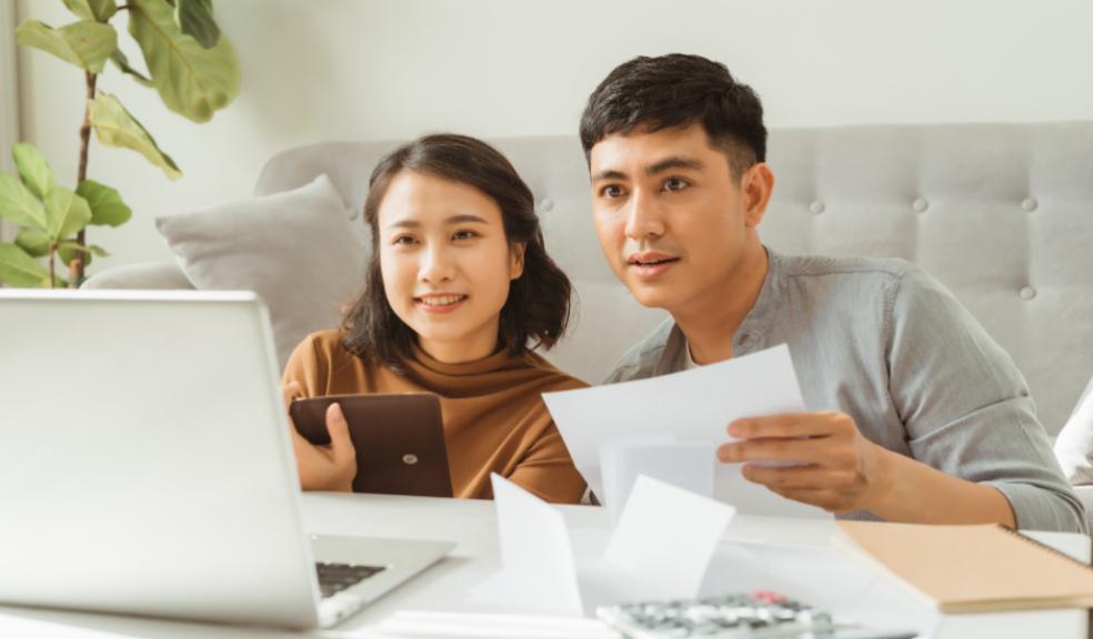 picture of a couple looking at their finances