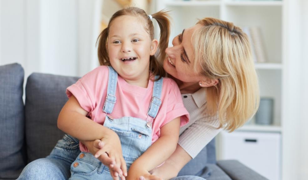 picture of a mum loving her disabled child