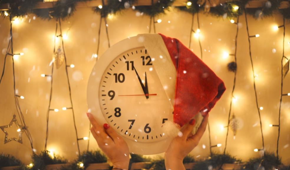 picture of a clock with a christmas hat on counting down to christmas