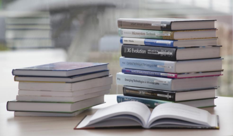 Picture of university books on a table