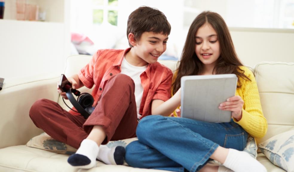 picture of happy boy and girl teens using the internet