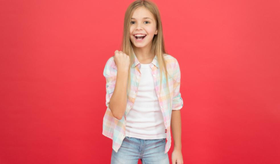 picture of a happy child on a red background