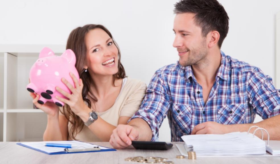 picture of happy couple working out finances