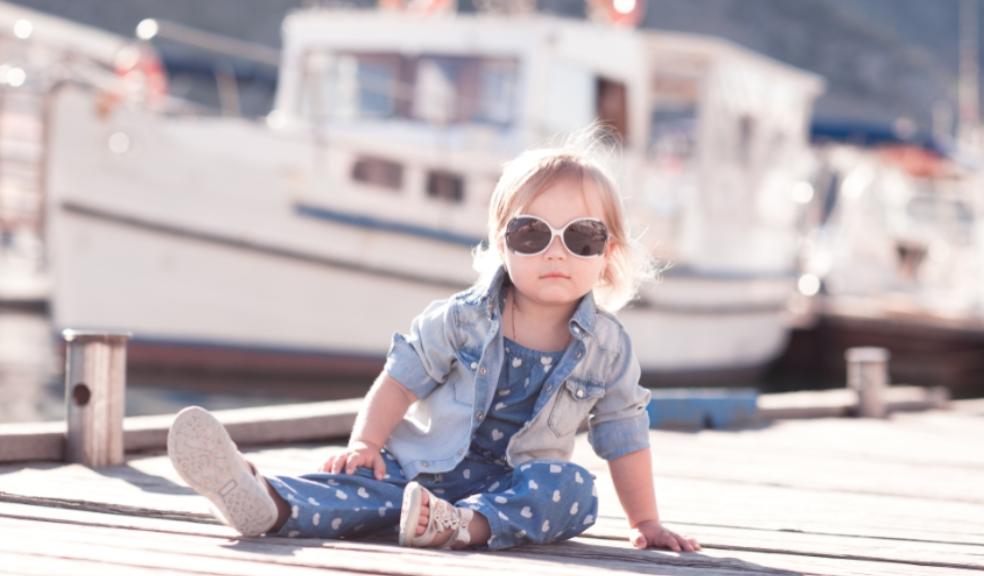 picture of trendy baby on a dock