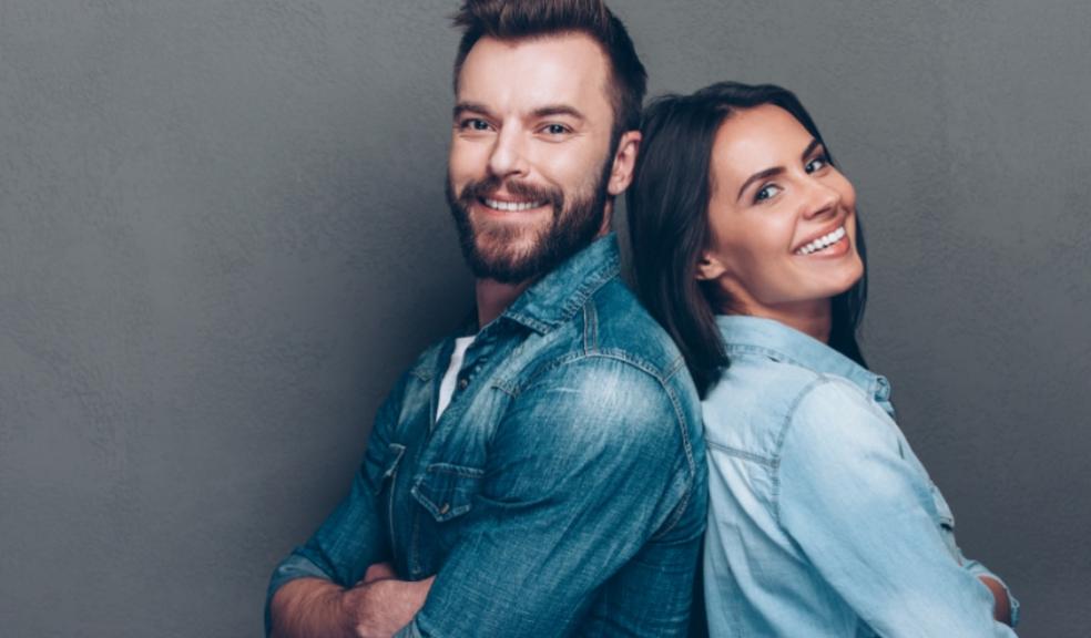 picture of happy man and woman back to back