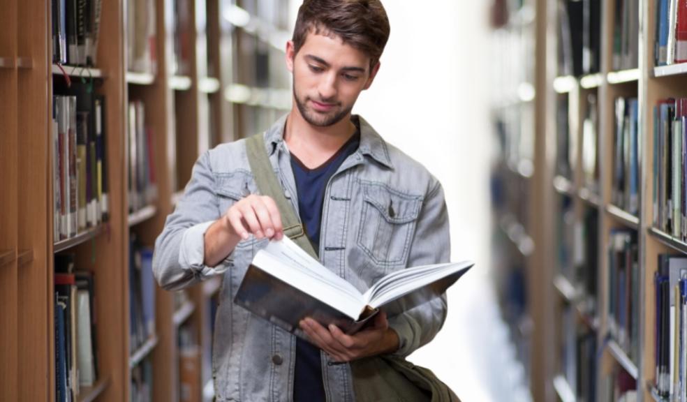 Picture of a male student in a library