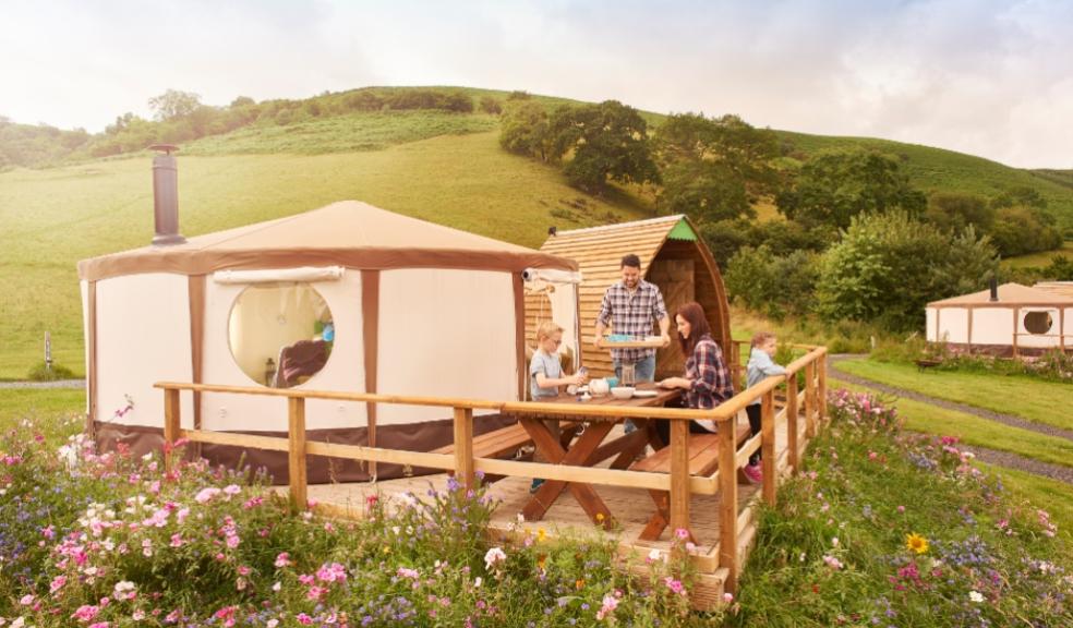 picture of a family having lunch at a glamping site
