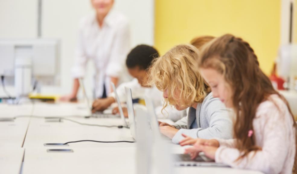picture of children using computers at school