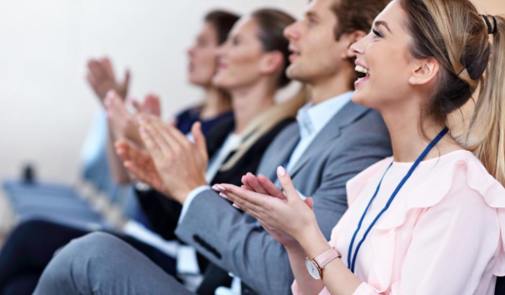 picture of happy people at a conference