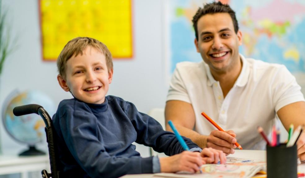 picture of a teacher with a student with special education needs 