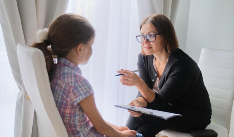 picture of a child talking to a therapist