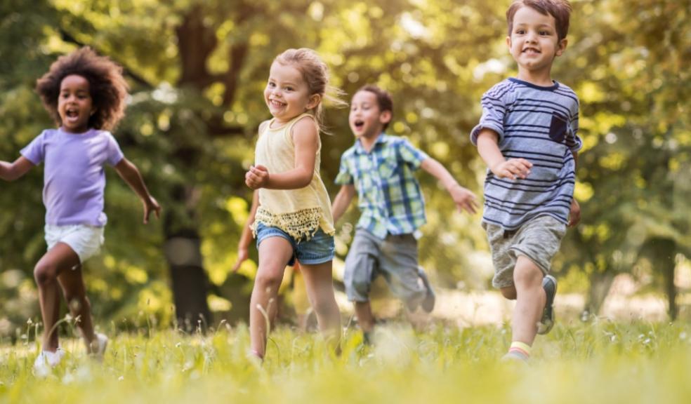 Picture of happy children running outside in the sun