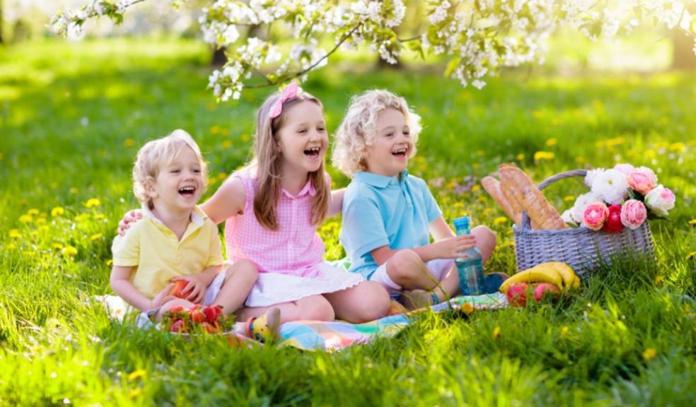 picture of happy children outside having a picnic